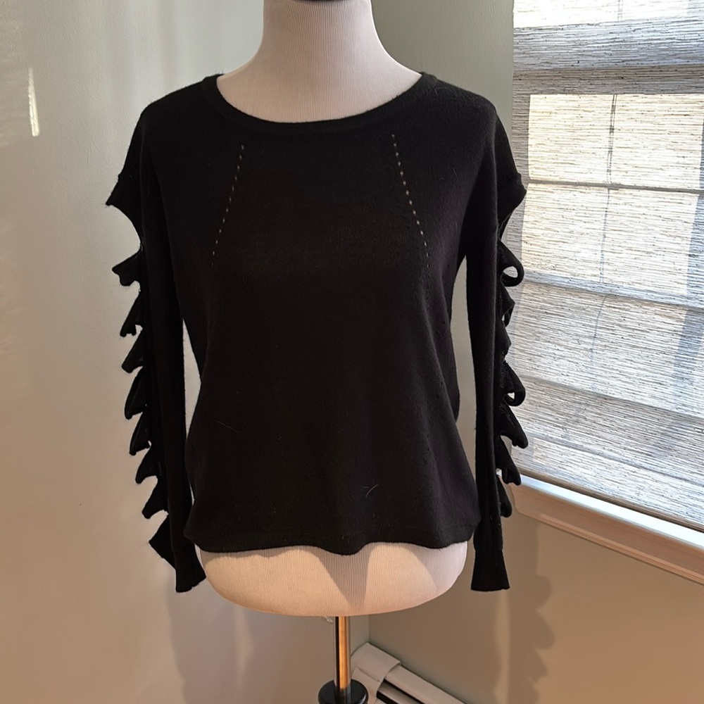 Black sweater arm detail